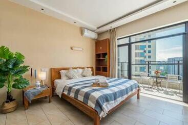 ホテル Sanya Xiaoyao Ocean View Apartment