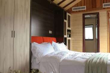 Отель Seclusion Scenery Of Shangshui International Rv Resort