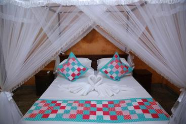 تختخواب و صبحانه Limecabanassrilanka