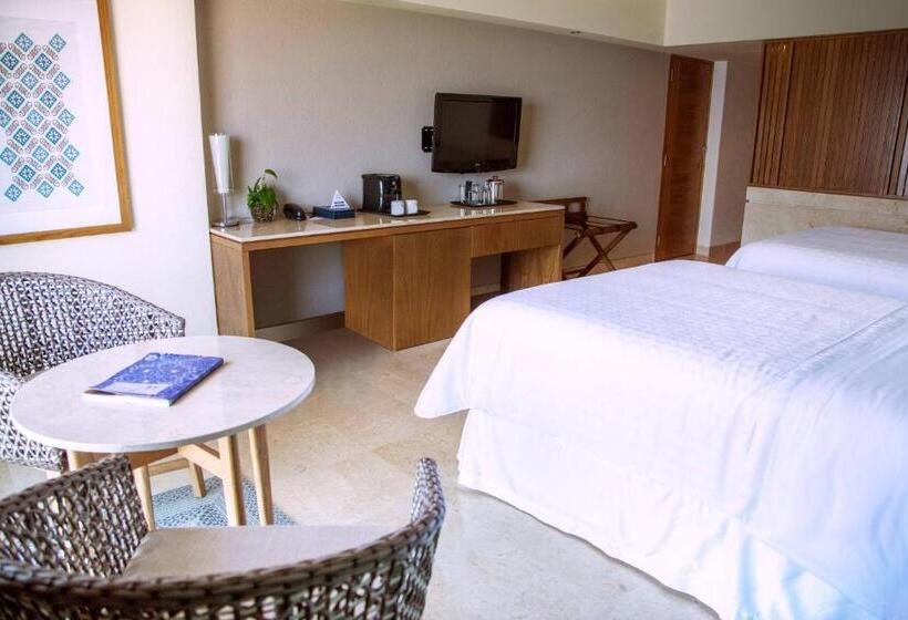 Quarto deluxe vista mar, Sheraton Buganvilias Resort & Convention Center