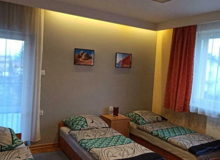 Standard Quadruple Room with Balcony, Noclegi Słodki Sen 1