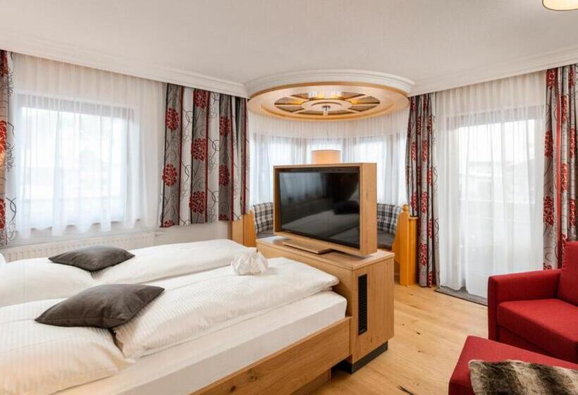 Номер Deluxe, Dorfstube