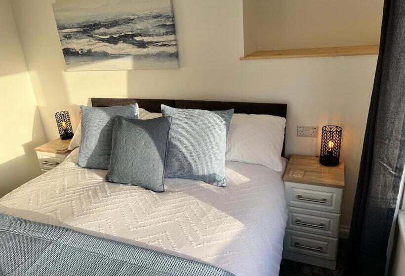חדר דלוקס עם מיטת קינג, Coach Guest House