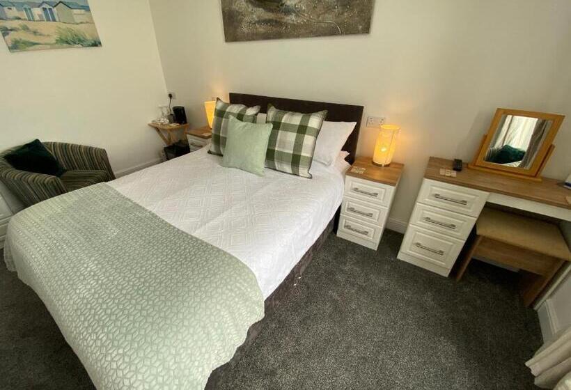 חדר דחוקס עם מיטת קינג, Coach Guest House