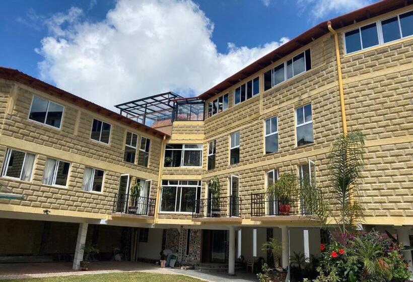 سرير فى غرفة مشتركه, & Suites Cerro Roj0