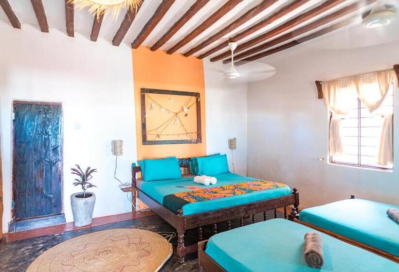 اتاق استاندارد سه تخته با چشم‌انداز باغ, Pili Pili Beach Bungalows