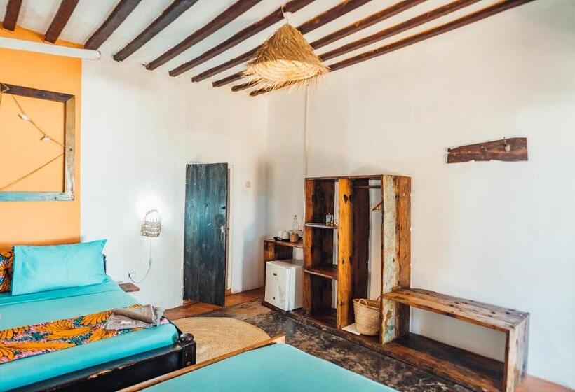 اتاق استاندارد چهارنفره با چشم‌انداز باغ, Pili Pili Beach Bungalows