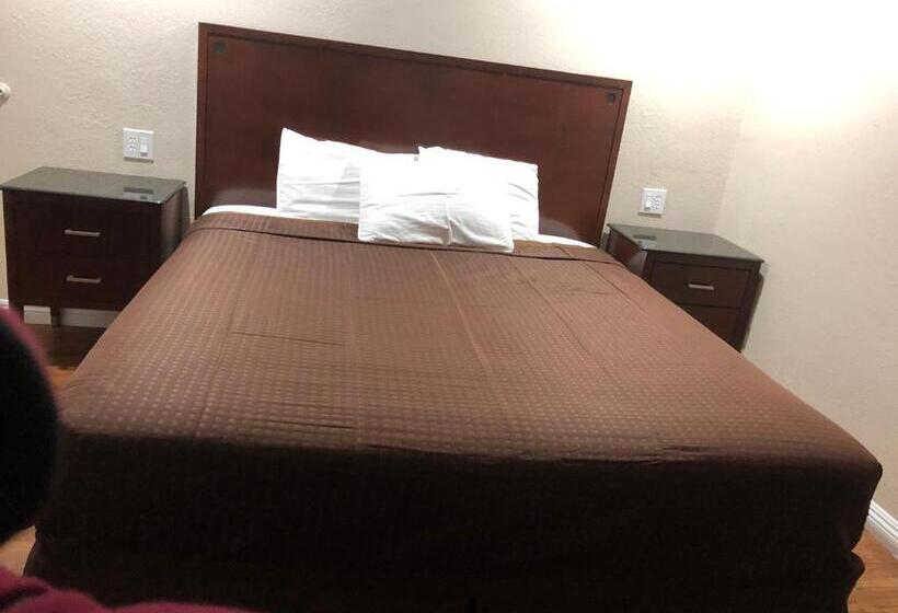 キングサイズベッドのスタンダードルーム, American Inn Ontario