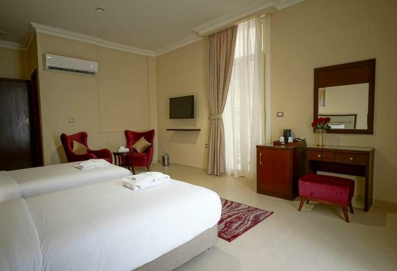 Habitación Deluxe Vista Ciudad, Savoy Hotel Elminya